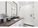 Modern bathroom with a large walk-in shower and dark vanity at 457 S Vine St, Denver, CO 80209