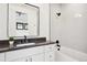 Bathroom with modern vanity, soaking tub, and shower at 457 S Vine St, Denver, CO 80209