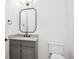 Modern powder room with gray vanity and a sleek mirror at 457 S Vine St, Denver, CO 80209