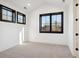Bright bedroom with neutral carpeting and large windows, providing ample natural light at 457 S Vine St, Denver, CO 80209