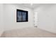 Bright bedroom with neutral carpeting and large window at 457 S Vine St, Denver, CO 80209
