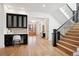 Bright entryway with built-in desk, hardwood floors, and elegant staircase at 457 S Vine St, Denver, CO 80209