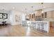 Modern kitchen with island, stainless steel appliances, and light wood cabinets at 457 S Vine St, Denver, CO 80209