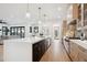 Modern kitchen with large island, stainless steel appliances, and open floor plan at 457 S Vine St, Denver, CO 80209