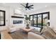 Living room features a fireplace, large windows, and sliding doors to patio at 457 S Vine St, Denver, CO 80209