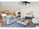 Comfortable living room with hardwood floors, and views into the kitchen area at 457 S Vine St, Denver, CO 80209