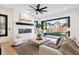 Bright and airy living room with hardwood floors, fireplace and large windows at 457 S Vine St, Denver, CO 80209