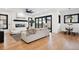 Spacious living room with fireplace, hardwood floors, and access to backyard at 457 S Vine St, Denver, CO 80209