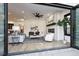 Open concept living room with hardwood floors, fireplace and access to backyard at 457 S Vine St, Denver, CO 80209