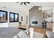 Spacious main bedroom with fireplace, wet bar, and large windows at 457 S Vine St, Denver, CO 80209