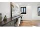 Home office with long desk, hardwood floors and large windows at 457 S Vine St, Denver, CO 80209
