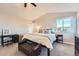 Main bedroom featuring a comfortable bed and plenty of natural light at 19664 E Caspian Cir, Aurora, CO 80013