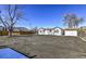 Large backyard with gravel, wooden fence, and detached shed at 15360 W 44Th Ave, Golden, CO 80403
