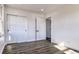 Spacious bedroom with wood-look floors and sliding door closet at 15360 W 44Th Ave, Golden, CO 80403