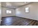 Spacious bedroom with wood-look flooring and large window at 15360 W 44Th Ave, Golden, CO 80403