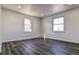 Bright bedroom with wood-look flooring and dual windows at 15360 W 44Th Ave, Golden, CO 80403