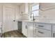 Modern kitchen features white shaker cabinets, quartz countertops, and stainless steel appliances at 15360 W 44Th Ave, Golden, CO 80403