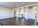 Open concept living room with modern flooring and kitchen view at 15360 W 44Th Ave, Golden, CO 80403