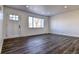 Spacious living room with new flooring and front door view at 15360 W 44Th Ave, Golden, CO 80403
