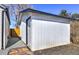 White storage shed with a single door and gravel pathway at 15360 W 44Th Ave, Golden, CO 80403
