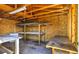Unfinished workshop with wooden walls and workbenches at 15360 W 44Th Ave, Golden, CO 80403