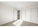 Well-lit bedroom with double doors and carpet flooring at 661 W 170Th Pl, Broomfield, CO 80023