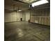 Spacious two-car garage with ample storage shelving and overhead door at 21064 E Crestline Cir, Centennial, CO 80015
