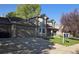 Two-story home with attached garage and landscaping at 21064 E Crestline Cir, Centennial, CO 80015