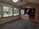Gathering room with kitchen access and backyard views at 21064 E Crestline Cir, Centennial, CO 80015