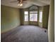 Spacious bedroom with vaulted ceiling, carpet, and bay window at 21064 E Crestline Cir, Centennial, CO 80015