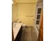Bathroom with double sinks, built-in shelves, and a bathtub at 21064 E Crestline Cir, Centennial, CO 80015