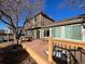 Backyard with deck, landscaping and built-in grill at 21064 E Crestline Cir, Centennial, CO 80015