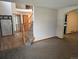 Open living area with carpet and view of staircase at 21064 E Crestline Cir, Centennial, CO 80015
