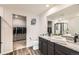 Bathroom features a large vanity with granite countertop at 877 Twining Ave, Brighton, CO 80601