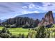 Picturesque golf course with mountain backdrop at 6301 Perry Park Blvd # 13, Larkspur, CO 80118