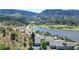 Aerial view of home with lake and mountain views in the background at 6301 Perry Park Blvd # 13, Larkspur, CO 80118
