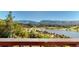 Panoramic view of lake, golf course and mountains at 6301 Perry Park Blvd # 13, Larkspur, CO 80118