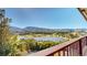 Deck overlooking a lake and mountain range at 6301 Perry Park Blvd # 13, Larkspur, CO 80118