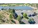 Aerial view of townhouses near a lake and golf course at 6301 Perry Park Blvd # 13, Larkspur, CO 80118