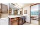 Bathroom with granite vanity and mountain views at 6301 Perry Park Blvd # 13, Larkspur, CO 80118