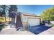 Townhouse exterior with attached garage and stairs at 6301 Perry Park Blvd # 13, Larkspur, CO 80118