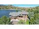 Lakeside home showcasing architectural details and landscaping at 6301 Perry Park Blvd # 13, Larkspur, CO 80118