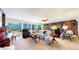 Spacious living room with stone fireplace and mountain views at 6301 Perry Park Blvd # 13, Larkspur, CO 80118