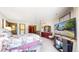 Bright bedroom with large TV and access to the bathroom at 6301 Perry Park Blvd # 13, Larkspur, CO 80118