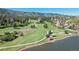 Stunning aerial view of a golf course community nestled in the mountains at 6301 Perry Park Blvd # 13, Larkspur, CO 80118