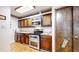 Kitchen features stainless steel appliances and wood cabinetry at 6301 Perry Park Blvd # 13, Larkspur, CO 80118