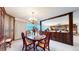 Elegant dining room with a view and built-in cabinetry at 6301 Perry Park Blvd # 13, Larkspur, CO 80118