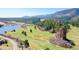 Scenic aerial of golf course and mountain range at 6301 Perry Park Blvd # 13, Larkspur, CO 80118