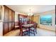 Bright dining room with mountain views and built-in hutch at 6301 Perry Park Blvd # 13, Larkspur, CO 80118