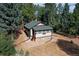 Secluded mountain cabin nestled in a wooded lot with a spacious yard at 5673 Santa Clara Rd, Indian Hills, CO 80454